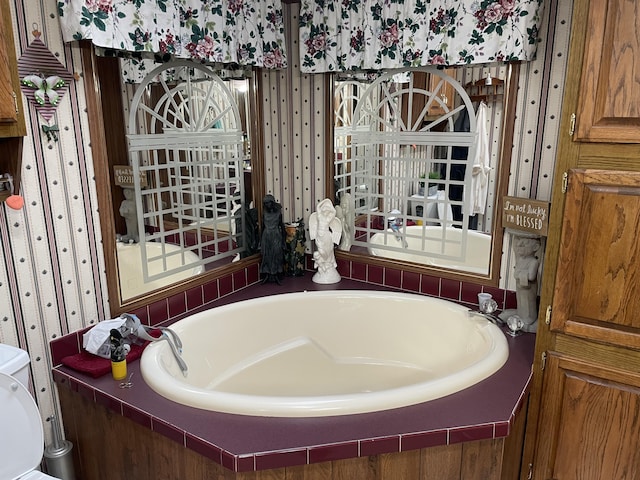 bathroom with a bathtub and toilet