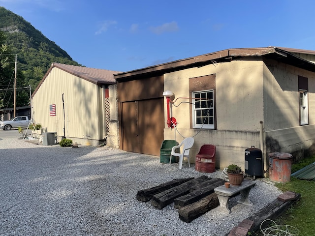 rear view of house with a mountain view