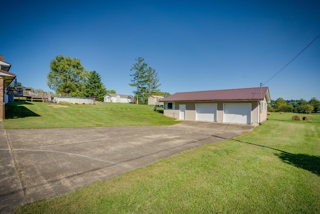 garage featuring a yard