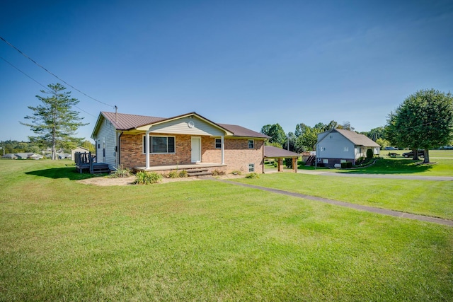 view of front of house featuring a carport, a porch, and a front lawn