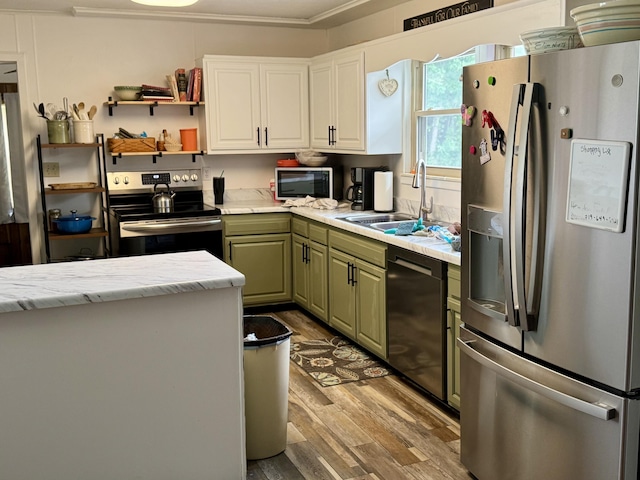 302 Buckingham Dr, Newport, TN 37821 - kitchen with stainless steel appliances, light wood finished floors, green cabinets, and white cabinetry
