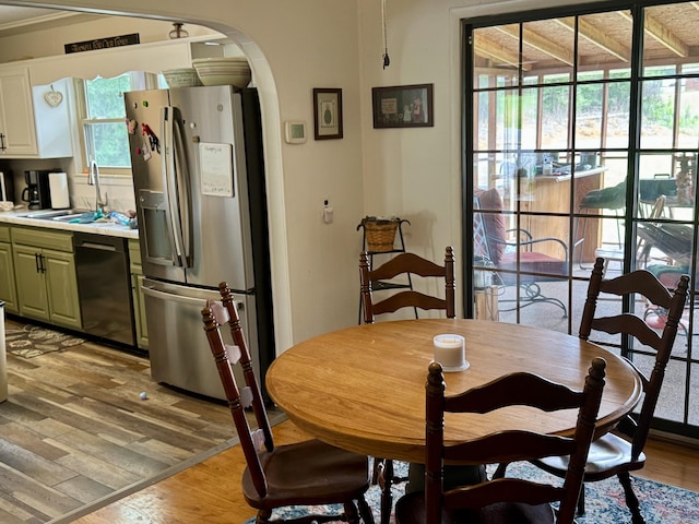 302 Buckingham Dr, Newport, TN 37821 - dining area featuring arched walkways and light wood-type flooring