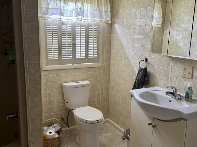 302 Buckingham Dr, Newport, TN 37821 - bathroom featuring tile walls, vanity, a shower, and tile patterned flooring