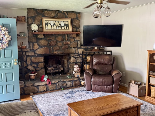302 Buckingham Dr, Newport, TN 37821 - living area featuring ceiling fan, wood finished floors, and a stone fireplace