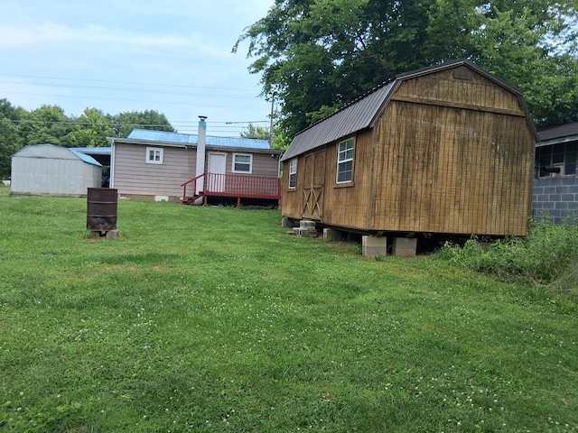 450 Old Sevierville Hwy, Newport, TN 37821 - rear view of property featuring a yard, a storage unit, a metal roof, and a gambrel roof