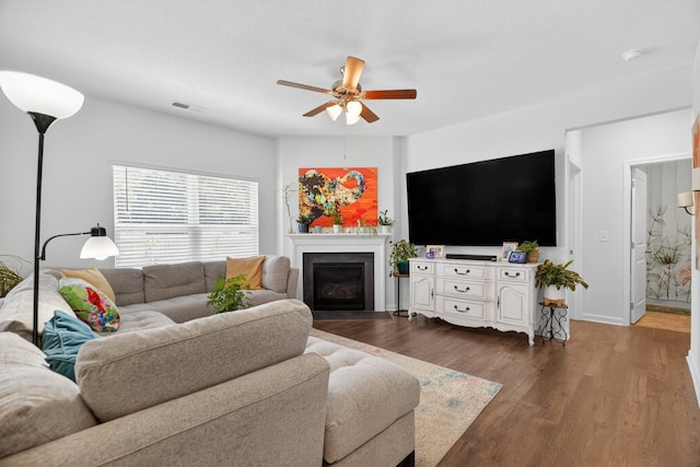 3059 Berna Way, Morristown, TN 37814 - living room with ceiling fan, a fireplace with flush hearth, and dark wood-style floors