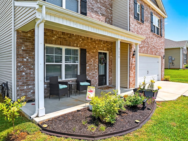 3059 Berna Way, Morristown, TN 37814 - entrance to property featuring covered porch, brick siding, a garage, and concrete driveway