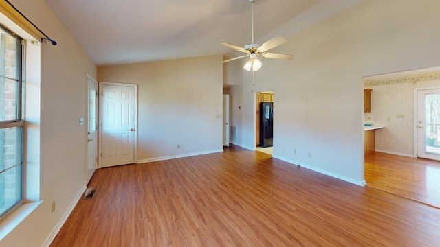 unfurnished room featuring ceiling fan, wood-type flooring, and high vaulted ceiling