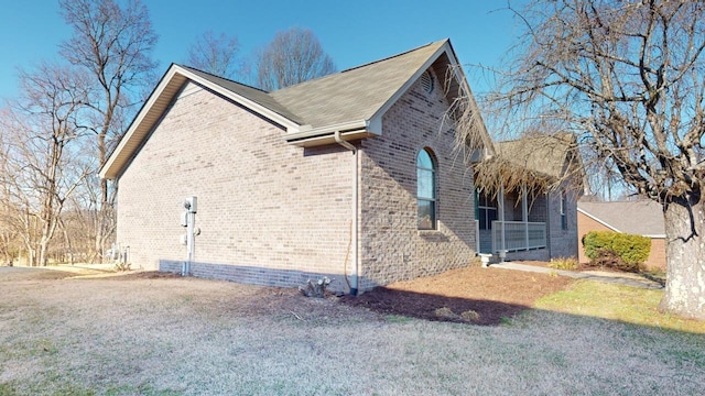 view of property exterior with a yard