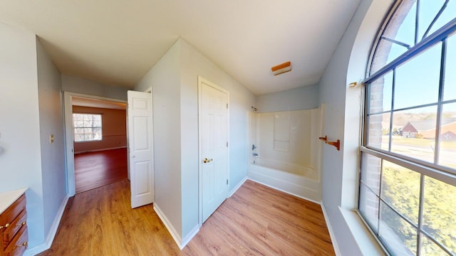 hallway with light wood-type flooring