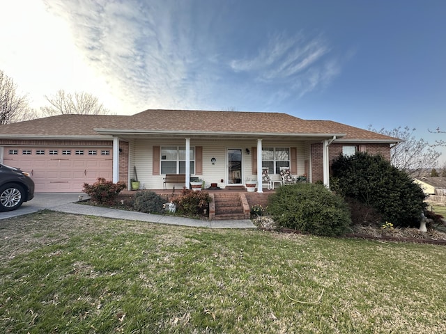 ranch-style home featuring a front yard, an attached garage, covered porch, concrete driveway, and brick siding