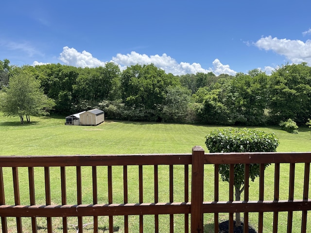 122 Florence Cir, Dandridge, TN 37725 - view of grassy yard with a storage unit and an outdoor structure