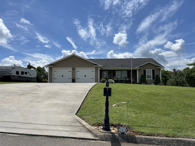 122 Florence Cir, Dandridge, TN 37725 - ranch-style home with driveway, a garage, and a front lawn