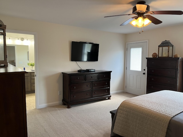 122 Florence Cir, Dandridge, TN 37725 - bedroom featuring light colored carpet, baseboards, ceiling fan, and connected bathroom