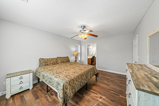 bedroom featuring a ceiling fan, dark wood-style flooring, a textured ceiling, and baseboards