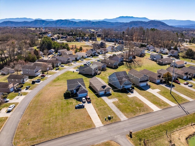 birds eye view of property with a mountain view and a residential view