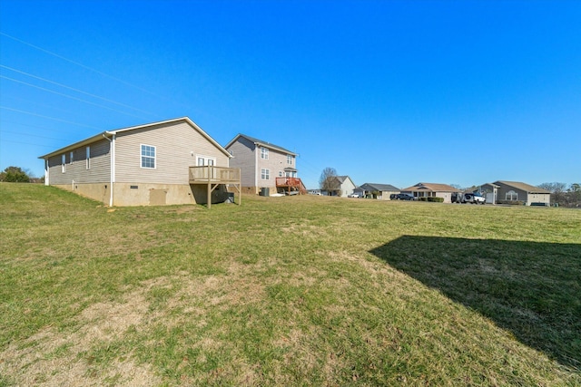 view of yard with a wooden deck