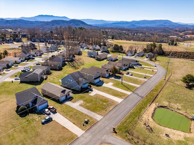 drone / aerial view with a residential view and a mountain view