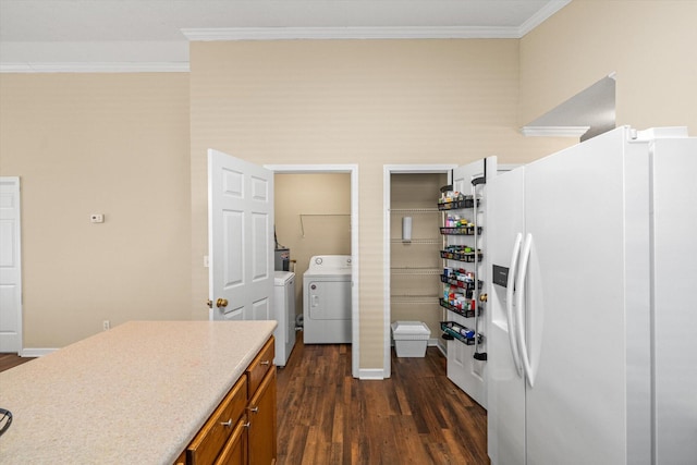 interior space with crown molding, washer / clothes dryer, brown cabinetry, dark wood-type flooring, and white fridge with ice dispenser