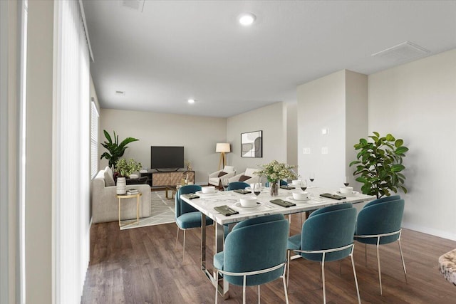 dining room with dark wood-type flooring