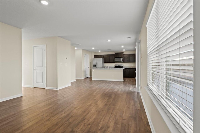unfurnished living room featuring dark hardwood / wood-style floors