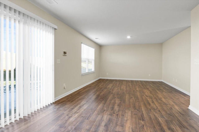empty room featuring dark hardwood / wood-style floors