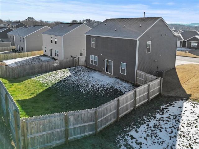 back of property featuring a lawn