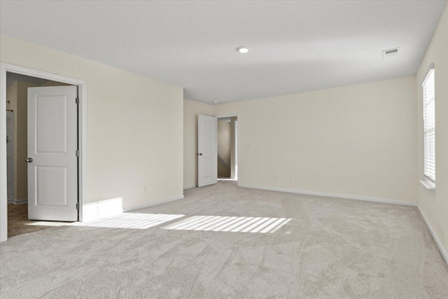 spare room with light carpet