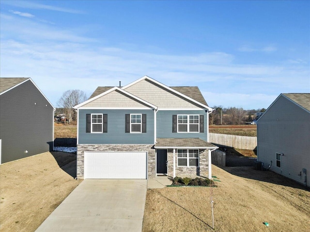 view of front of home with a garage and a front yard