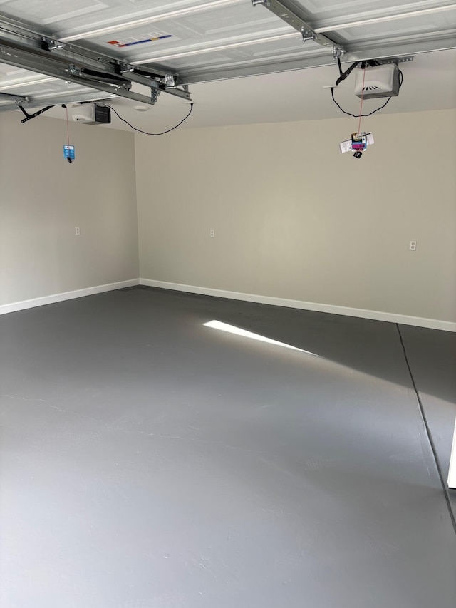 219 Inman St, Morristown, TN 37813 - garage featuring a garage door opener and baseboards