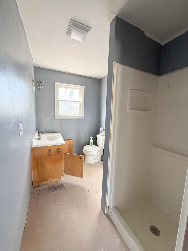 bathroom with a shower, toilet, and sink