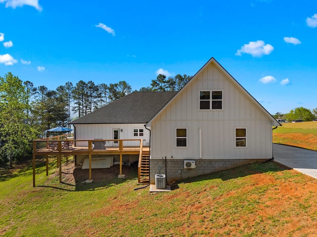 323 Eagle Claw Ln, Dandridge, TN 37725 - rear view of house featuring board and batten siding, stairway, a deck, and a lawn