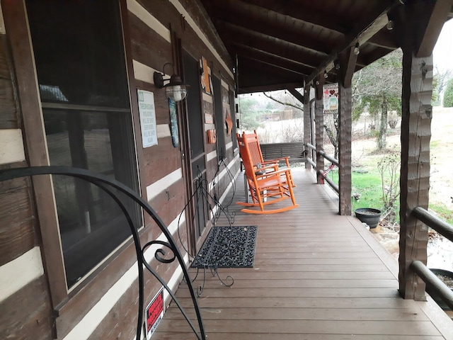 wooden terrace with covered porch