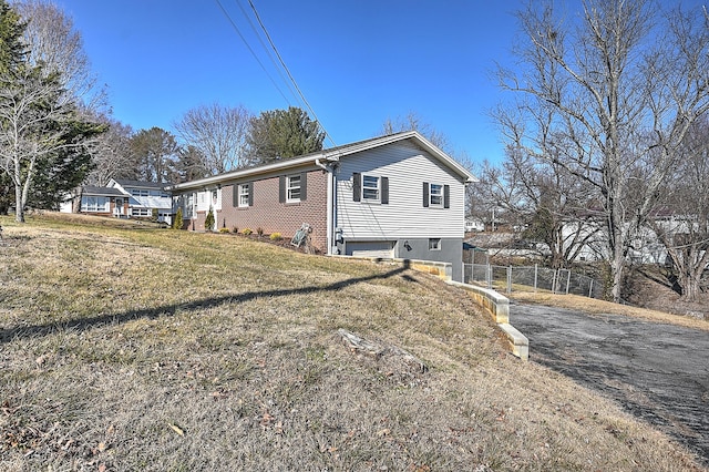 view of property exterior with a lawn