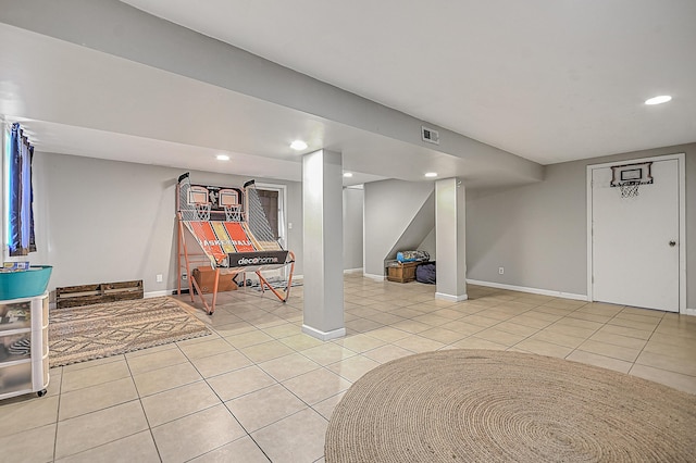 basement featuring light tile patterned flooring