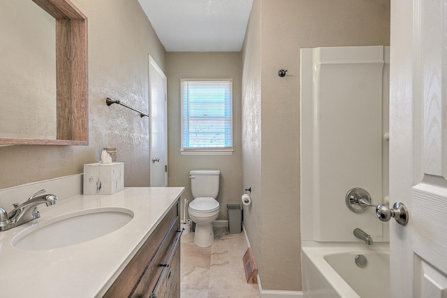 full bathroom featuring vanity, tub / shower combination, a textured ceiling, and toilet