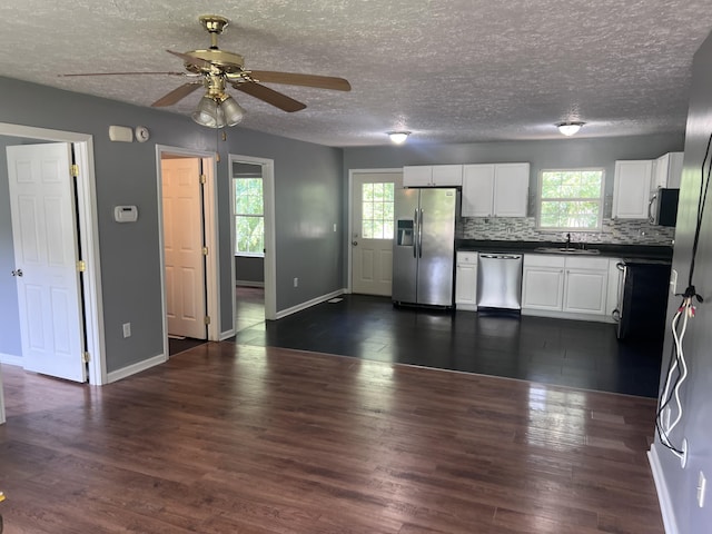 575 Paw Paw Way, Newport, TN 37821 - kitchen featuring stainless steel appliances, a sink, dark countertops, ceiling fan, and baseboards