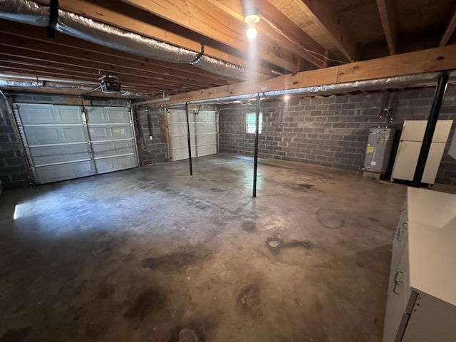 575 Paw Paw Way, Newport, TN 37821 - garage with water heater, a garage door opener, and freestanding refrigerator