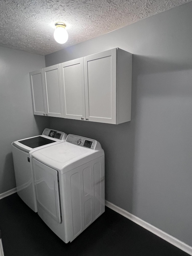 575 Paw Paw Way, Newport, TN 37821 - laundry area featuring washer and dryer, cabinet space, a textured ceiling, and baseboards