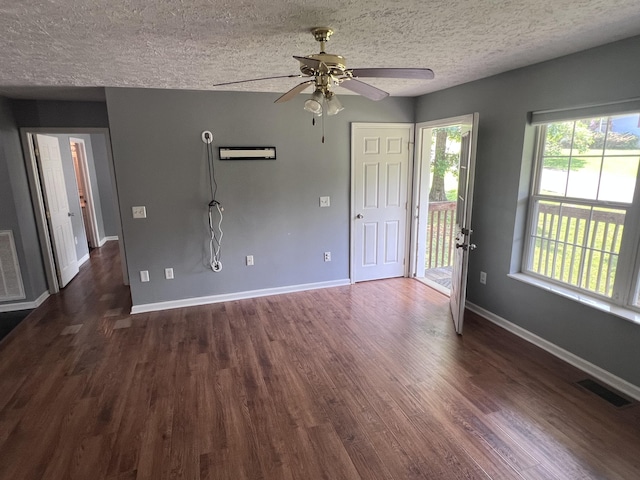 575 Paw Paw Way, Newport, TN 37821 - unfurnished living room with dark wood finished floors, baseboards, ceiling fan, and a textured ceiling