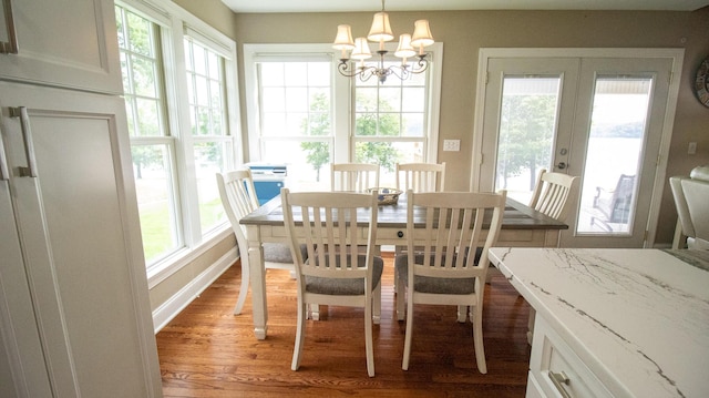 976 Bridgeview Hills Dr, Dandridge, TN 37725 - dining area with light wood finished floors, a chandelier, and french doors