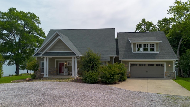 976 Bridgeview Hills Dr, Dandridge, TN 37725 - craftsman inspired home featuring stone siding, concrete driveway, a porch, and a shingled roof