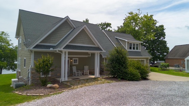 976 Bridgeview Hills Dr, Dandridge, TN 37725 - view of front of property featuring covered porch, driveway, roof with shingles, and a garage