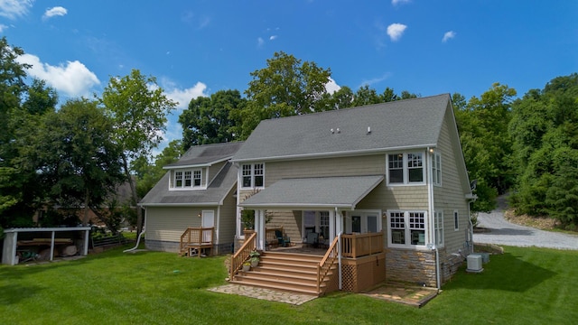 976 Bridgeview Hills Dr, Dandridge, TN 37725 - back of house featuring a lawn, a wooden deck, a shingled roof, and stone siding