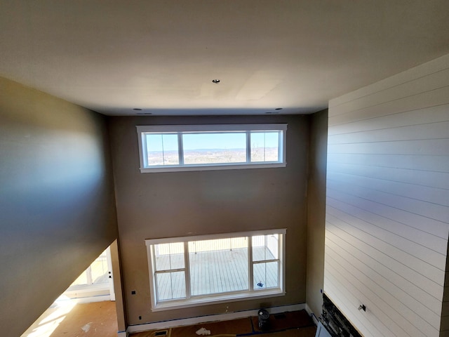 unfurnished living room with visible vents