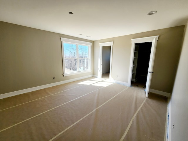 unfurnished bedroom with baseboards