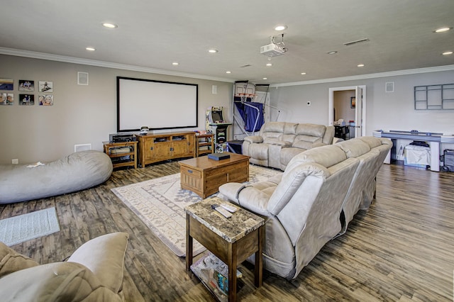 home theater room with crown molding and hardwood / wood-style floors