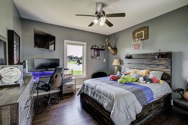 bedroom with ceiling fan and dark hardwood / wood-style flooring