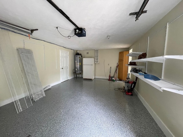 garage featuring white fridge, gas water heater, and a garage door opener