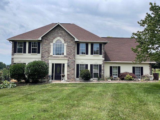 colonial inspired home with a front lawn